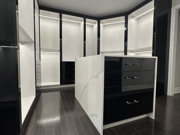 “Luxury high-gloss MDF walk-in closet with integrated LED lighting and marble-style island – custom closet design Toronto.”