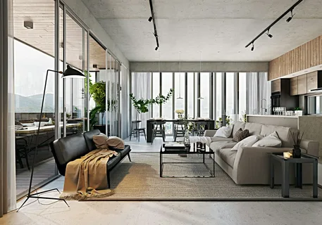 A beautifully designed open concept living and dining space featuring large floor-to-ceiling windows, modern track lighting, a beige sectional sofa, black accent furniture and warm natural materials. Renovation and interior design by Delghavi Design and Build in Ontario.