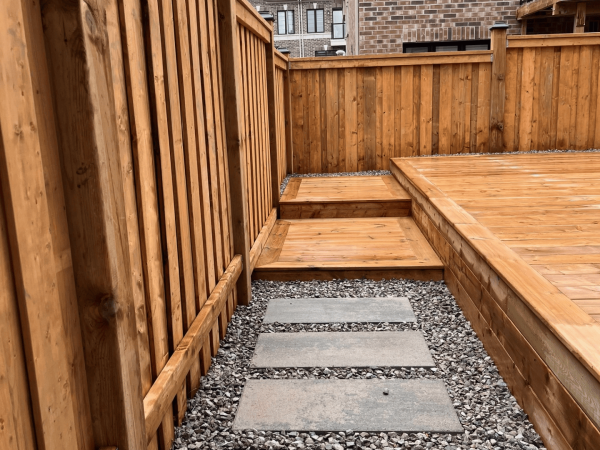 Custom deck steps and stone pathway built in Toronto backyard by delghavi design and builkd