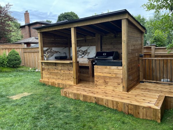Custom backyard BBQ pavilion and deck built in Toronto by delghavi design and build